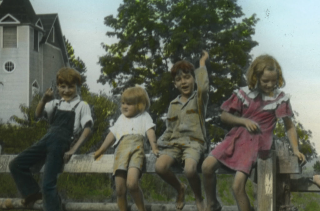 Vintage colorized photograph of four children