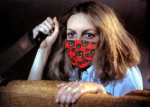 Ultimate scream queen Jamie Lee Curtis as Laurie Strode in John Carpenter's 1978 masterpiece Halloween. A pandemic mask with tiny Halloween pumpkins has been photoshopped to her face.
