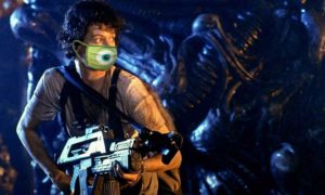 Sigourney Weaver in the movie alien stalking her prey with a big gun and wearing a photoshopped COVID mask.