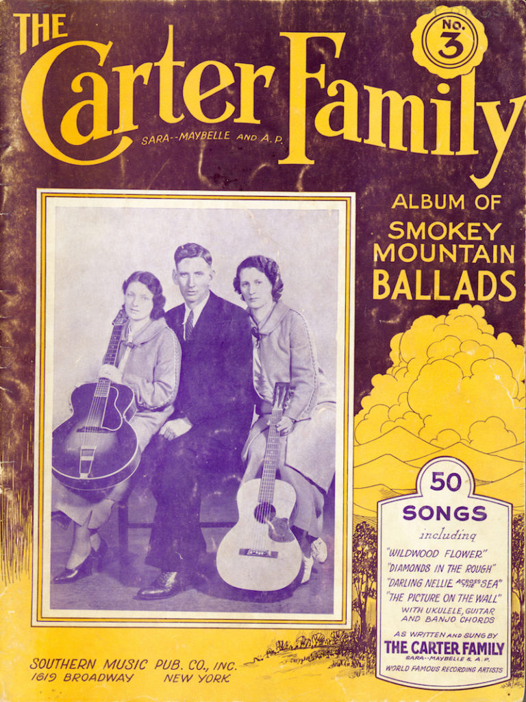 Cover of The Carter Family songbook Album of Smoky Mountain Ballads -- picture of the Carters on the front showing Maybelle and Sara with guitars and A. P. without an instrument
