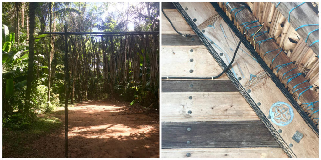 Left: A earthen path marked with a horizontal wooden branch with hanging elements on it to mark the entrance to a village; right: boards from a house (looks like a ceiling), including carved elements.