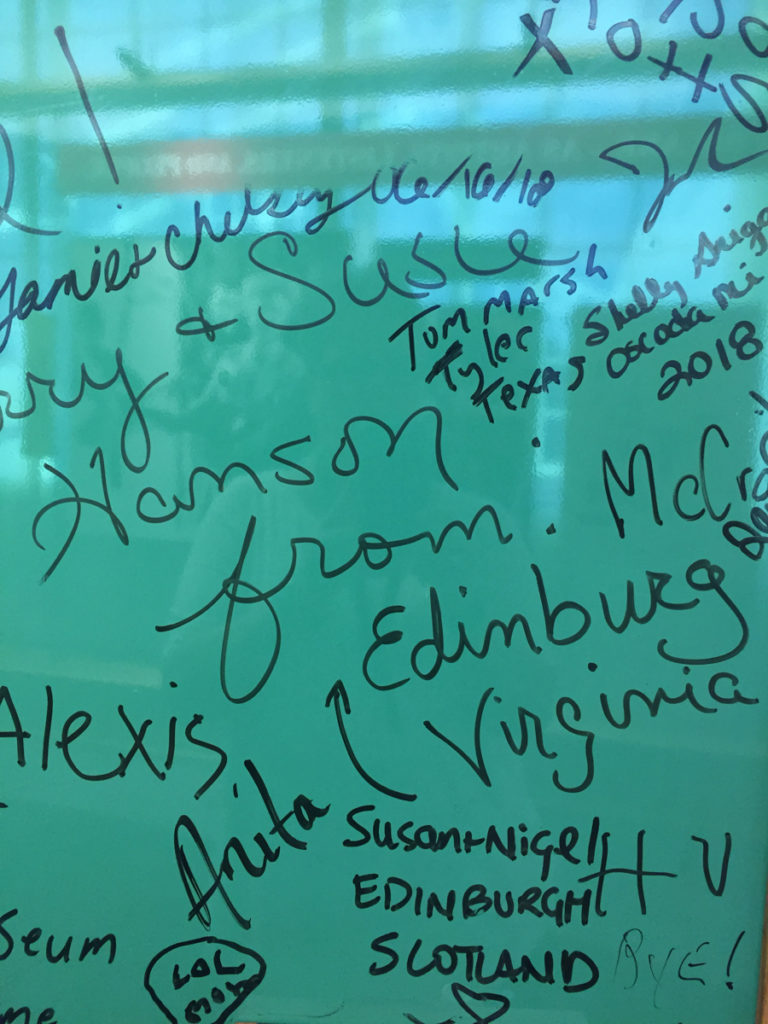 A picture of two of the signatures on the museum's interactive Green Board -- one from someone in Edinburgh, Scotland, and the other from someone in Edinburg, VA!