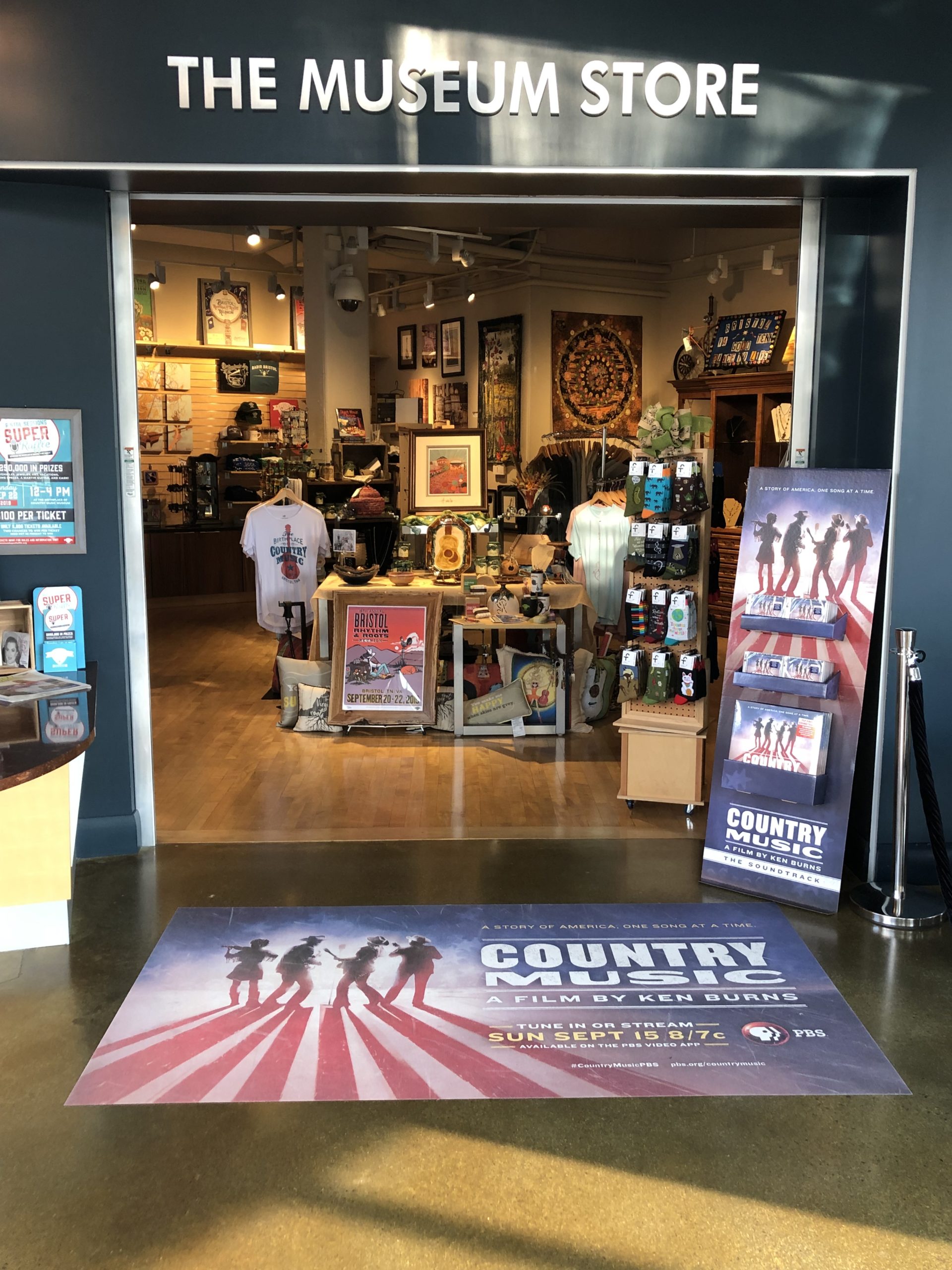 A shot of The Museum Store entrance with promotional displays related to Ken Burns' Country Music.