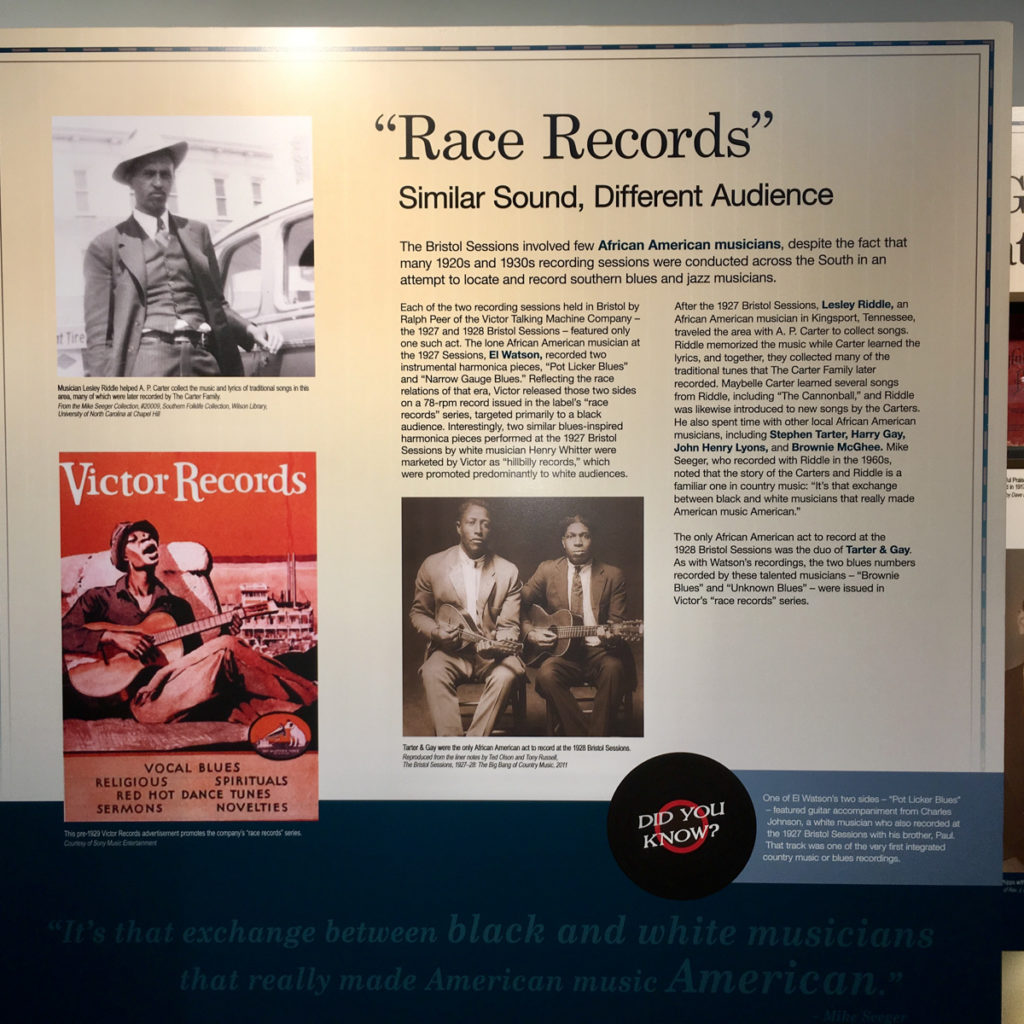 Race records panel in museum, with descriptive text and three images: Lesley Riddle, a Victor race records catalog cover, and Stephen Tarter with his cousin