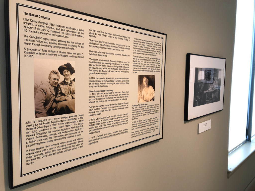 Photograph shows the panel from the Cecil Sharp exhibit focused on Olive Dame Campbell beside a photograph of Campbell.
