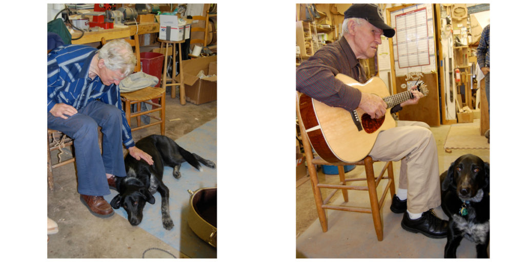 Two pictures of Doc Watson in the Henderson workshop, one where he is leaning down to pet Harper, a black hound-looking dog, and the other with him playing a guitar while Harper sits at his feet.