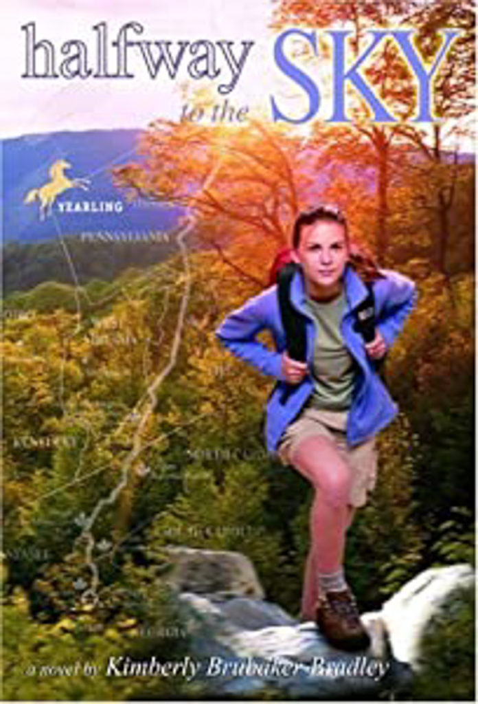 Cover of the book showing a young girl stepping up onto a rock on the trail with the mountains showing behind her.