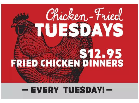 Red advertisement bearing a drawing of a chicken with text about "Chicken-Fried Tuesdays" overlaying the image.