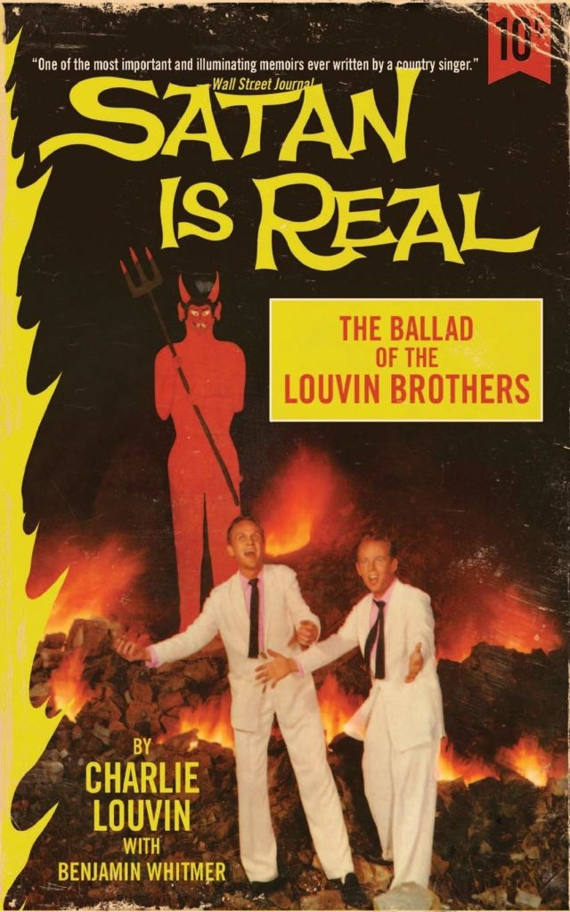 The book cover shows a tall grinning Satan figure in the background, surrounded by fire, with the two Louvin Brothers in white suits and black ties singing in the foreground.