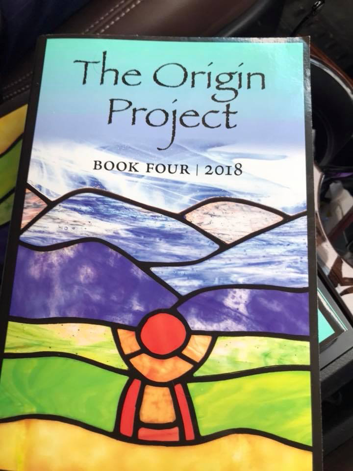 The cover of The Origin Project Book Four (2018), which looks like a stained glass view of the Blue Ridge Mountains.