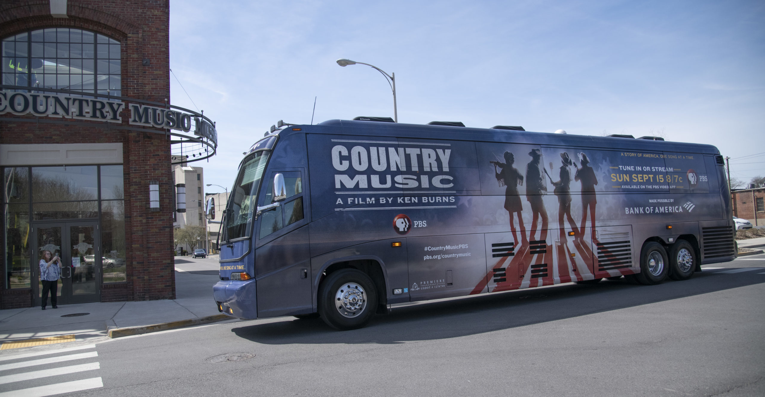 The Ken Burns' Country Music bus, wrapped in an image of four musicians to promote the documentary, pulls up to the front door of the Birthplace of Country Music Museum.
