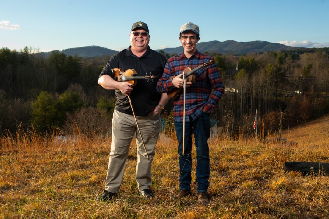 Photo of Eddie Bond, left, apprenticed Andrew Small in the Grayson and Carroll Country styles of old-time fiddling. The pair is featured along with seven others in the Virginia Folklife Apprenticeship film. Photo credit: Patt Jarrett, Virginia Humanities.