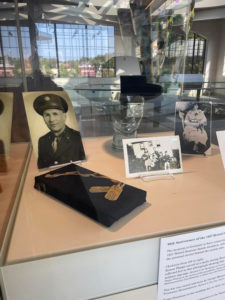 The case on display at the museum has several 1927 Bristol Sessions artists' items, including Ernest Phipp's metal dog tags lying on a small black pedastel in front of a photograph of him in military uniform.