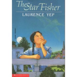 Book cover with the drawing of a young Asian American girl standing at a fence with a house behind her. You can also see the expansive blue night sky and mountains behind her. She is wearing a blue top or dress, and her black hair in in pigtails/braids. She has her chin on one hand and gazes at the sky.