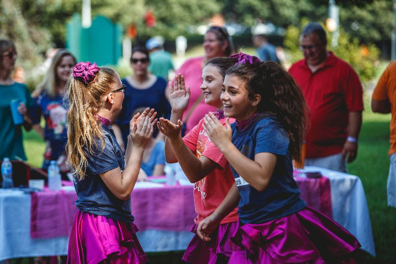 A photo of little girls dancing in pretty dresses at Children's Day at Bristol Rhythm & Roots Reunion.