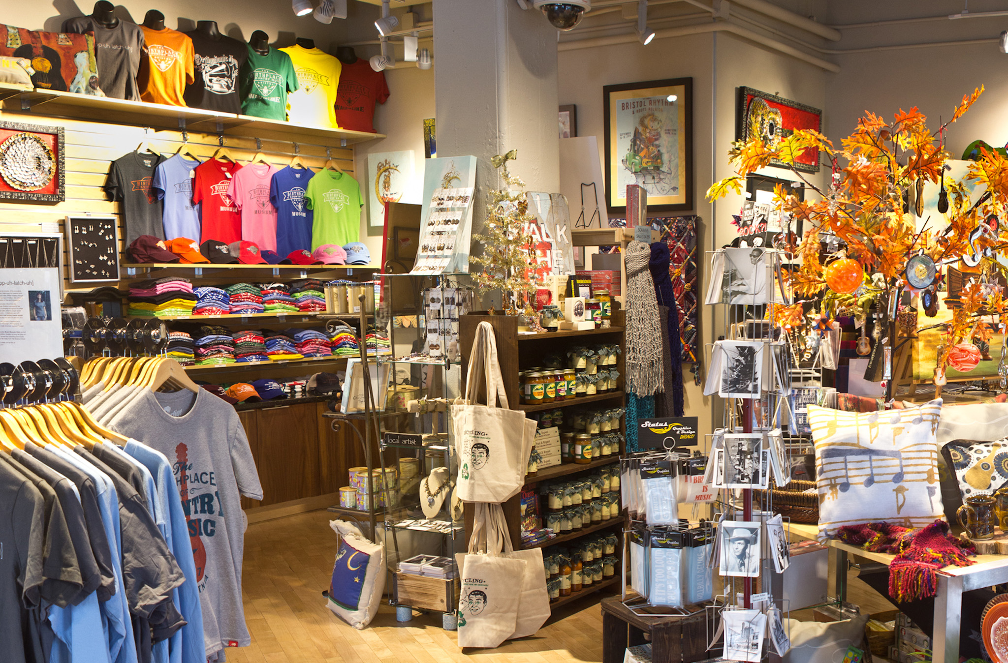 A photo of the inside of The Museum Store at the Birthplace of Country Music Museum with a wide variety of merchandise on display.