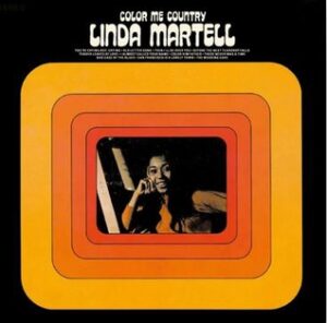Album cover. The words "Color Me Country" sit atop "Linda Martell" in large white font on a black background. The title is above a large box that takes up most of the image with four different shades of orange boxes getting progressively smaller inside it until the middle box, which is filled with an image of a black woman singing.