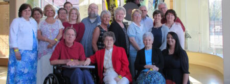 A group of docents standing in the lobby of the Birthplace of Country Music Museum.