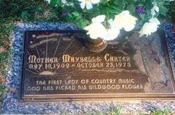 Bronze grave marker that says "Mother Maybelle Carter, The First Lady of Country Music. God has picked his wildwood flower."