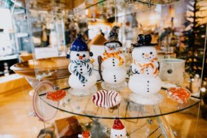 A photo of snowmen made of glass in The Museum Store at the Birthplace of Country Music Museum.