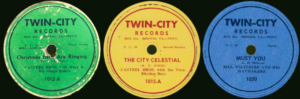 three round record stickers in different colors